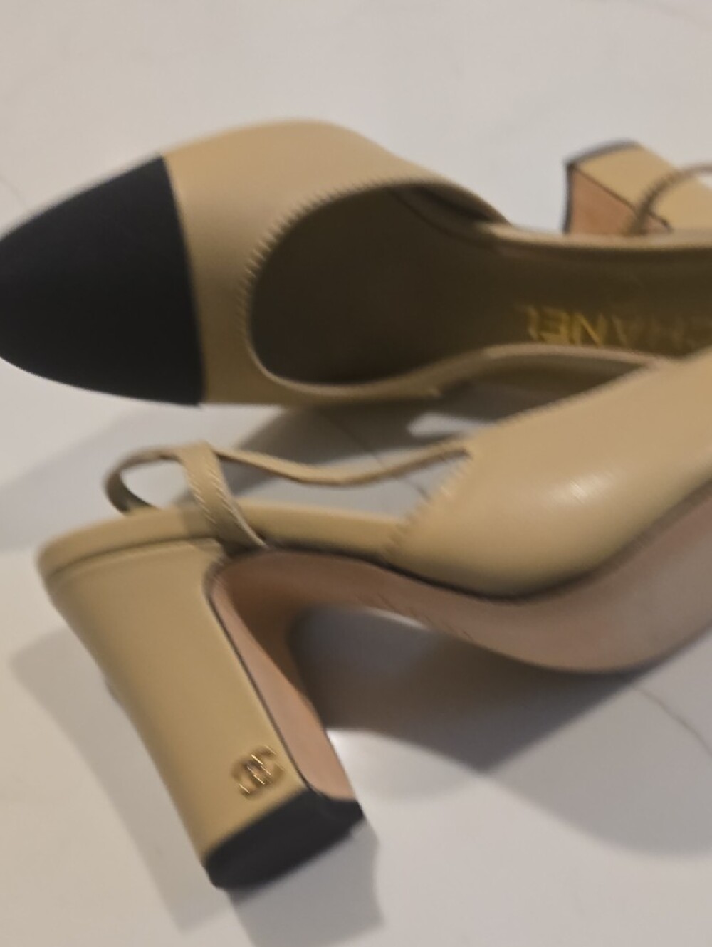 CHANEL Beige and Black Iconic Two-Tone Slingback Pumps with Cap Toe - Picture 4 of 6